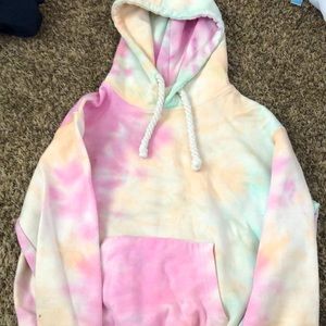 A cropped small tie dyed hoodie with rope like strings